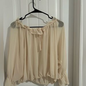 tan see-through blouse